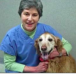Dr. Heidi McMorrow with a golden retriever